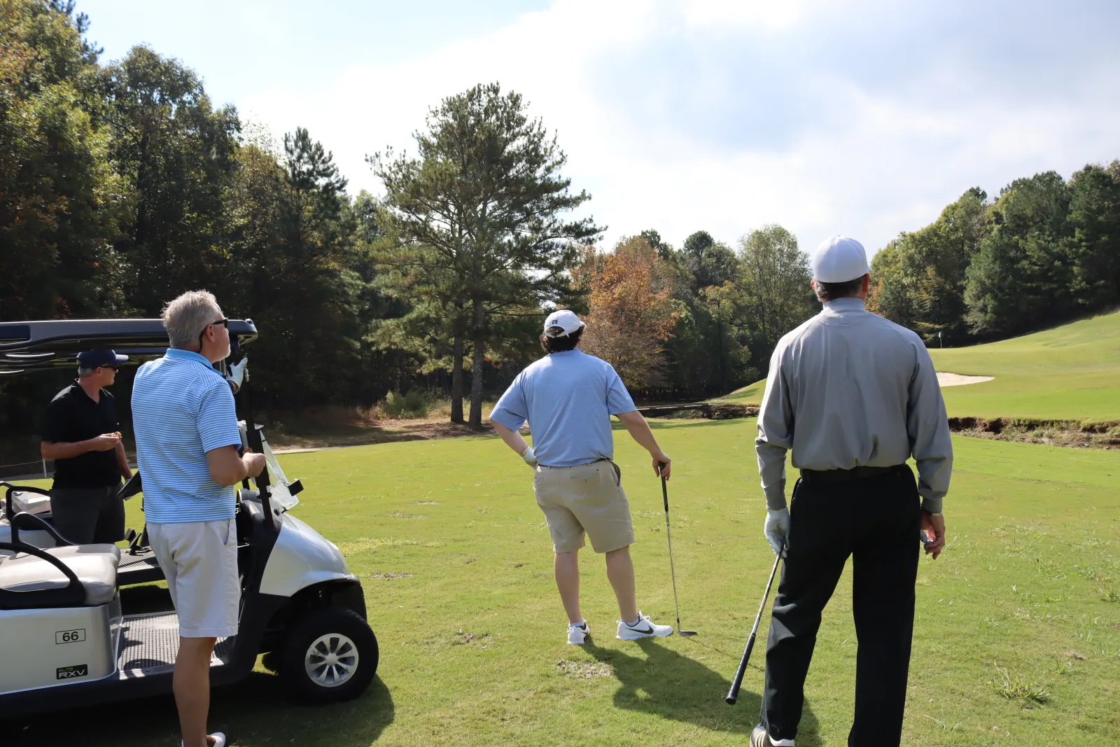 a group of people playing golf