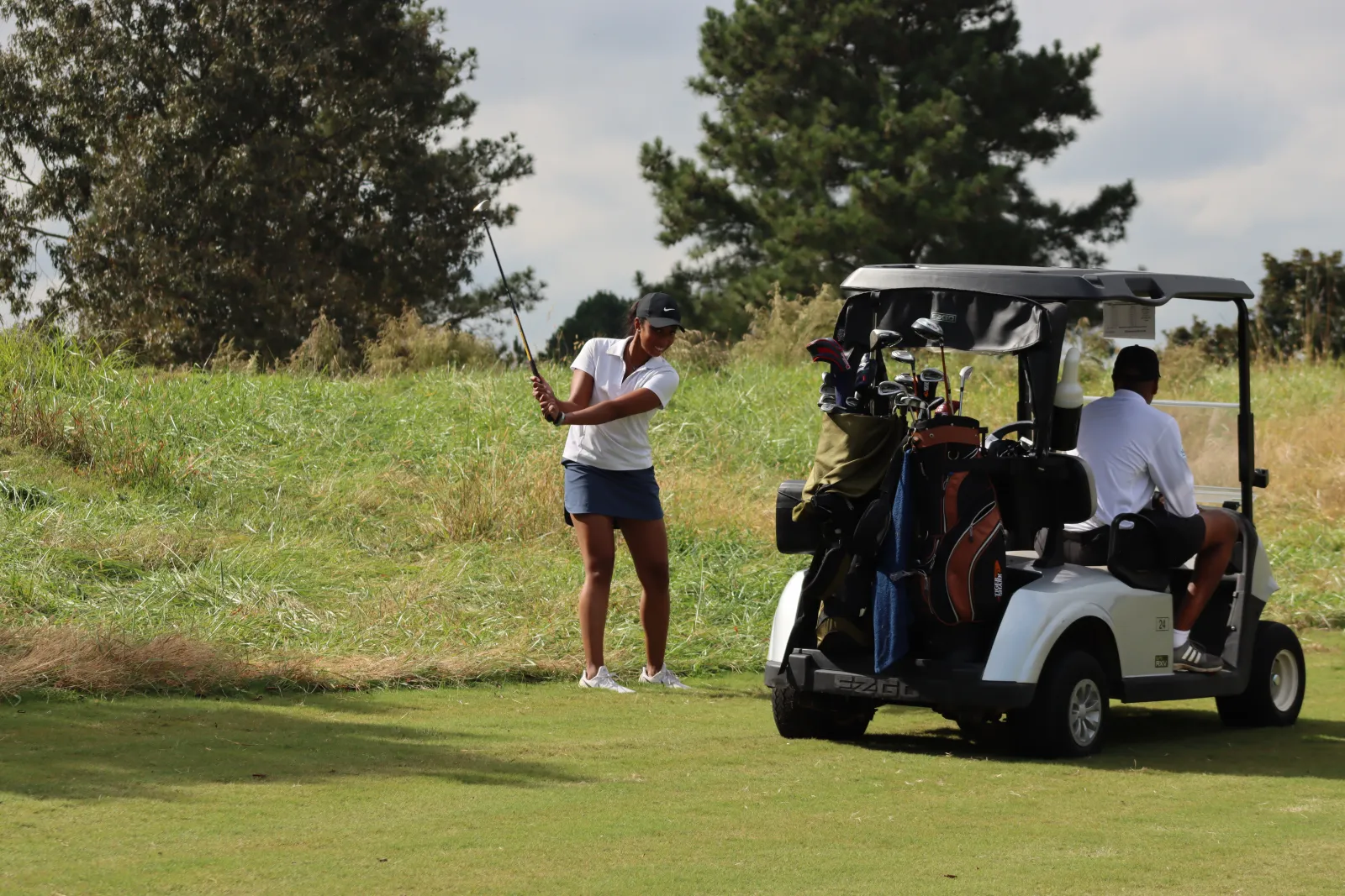 a person driving a golf cart