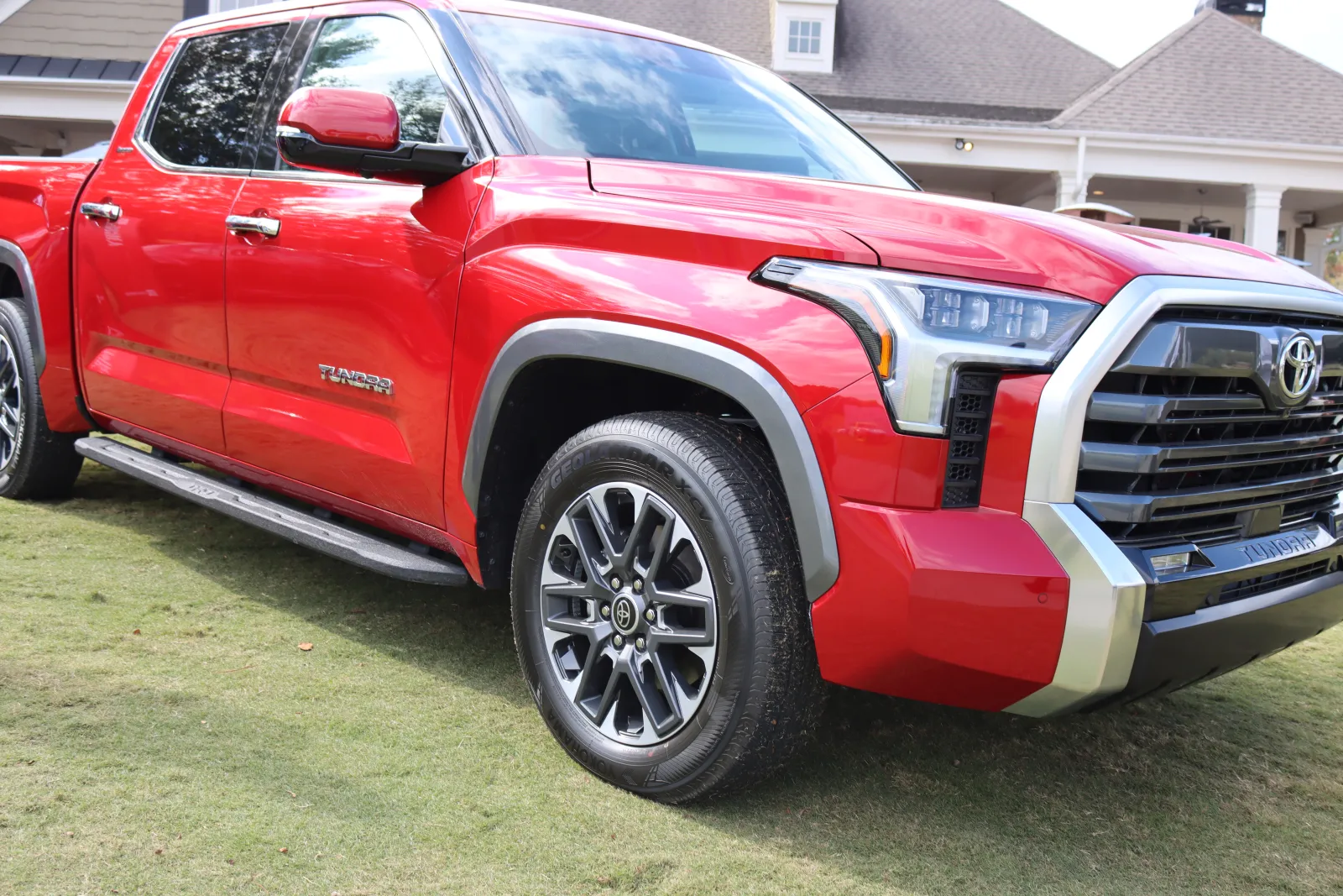 a red car parked on grass