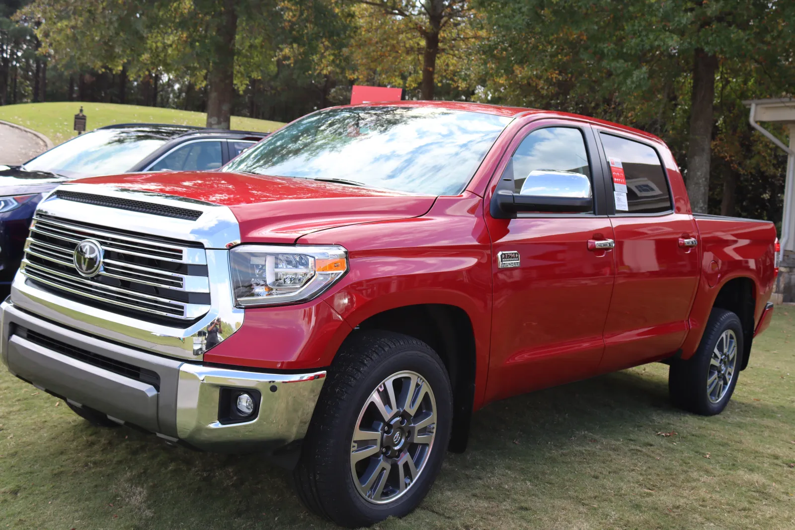 a red truck parked in a parking lot