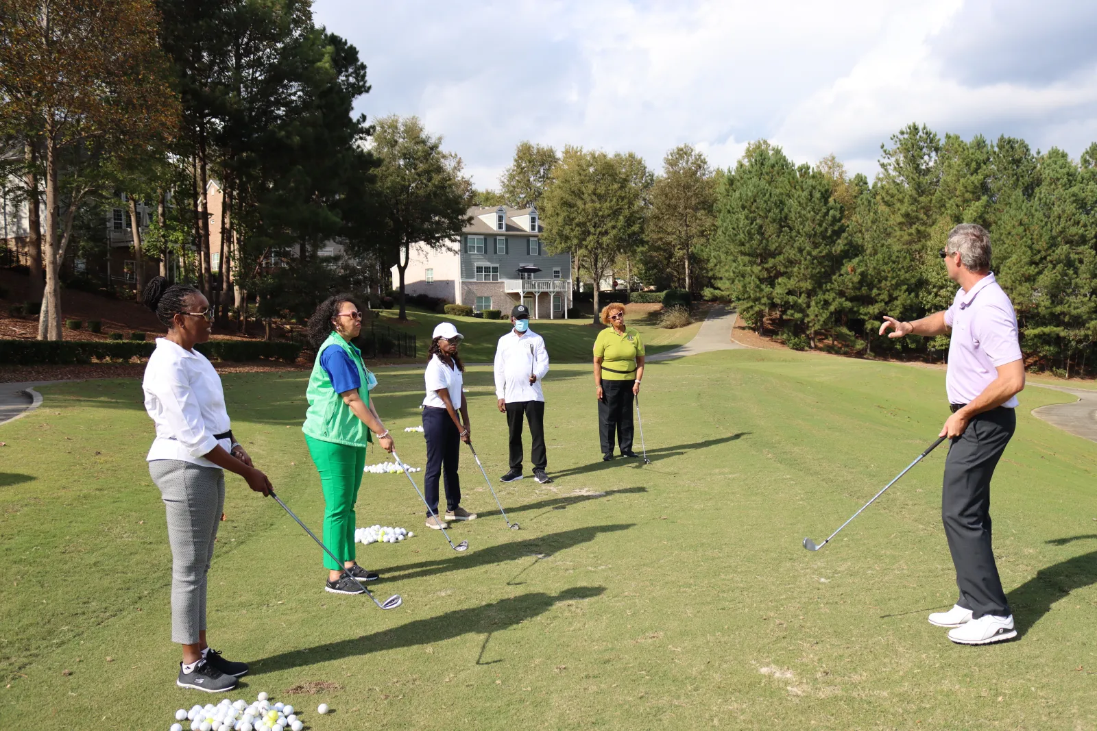 a group of people playing golf