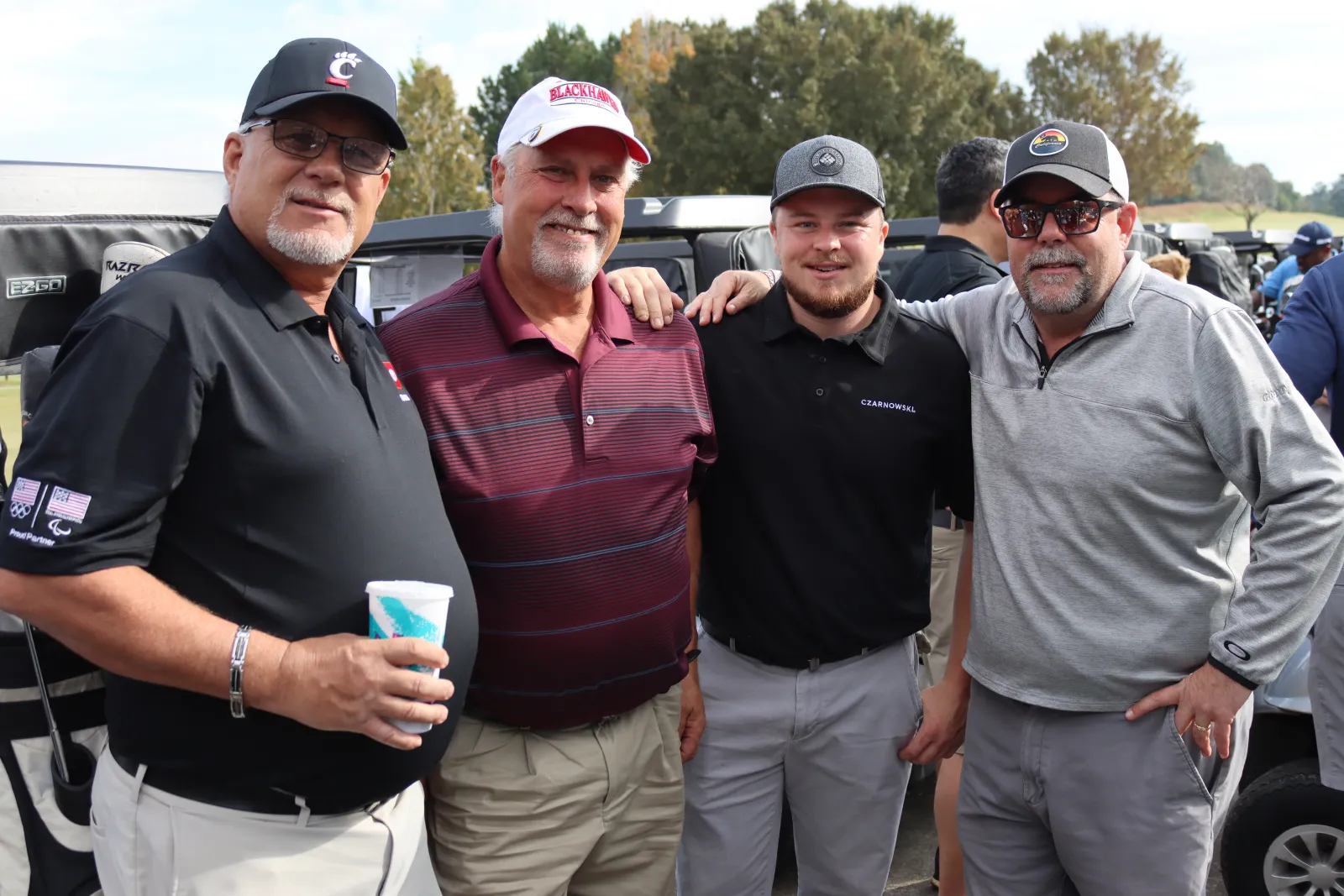 a group of men posing for a photo