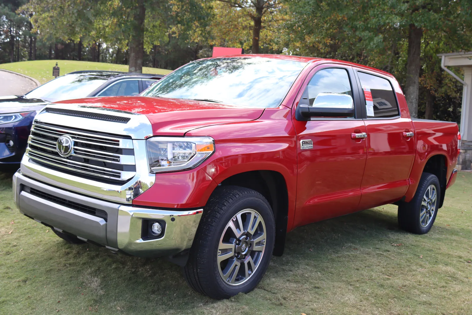 a red truck parked in a parking lot