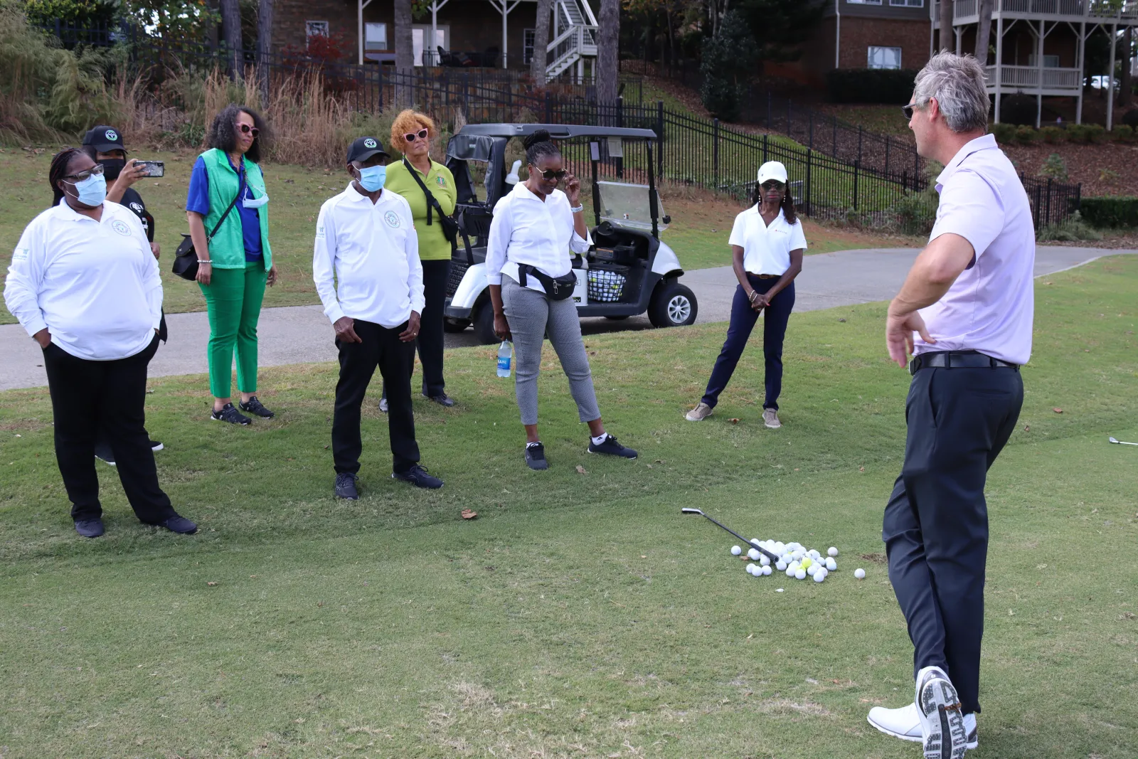 a group of people playing golf