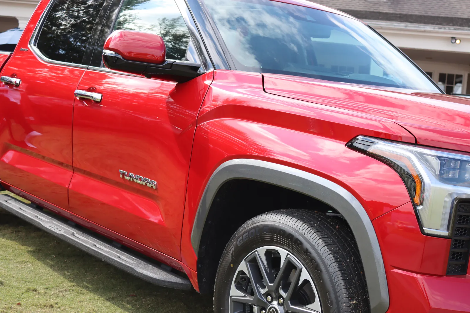 a red car parked in a driveway