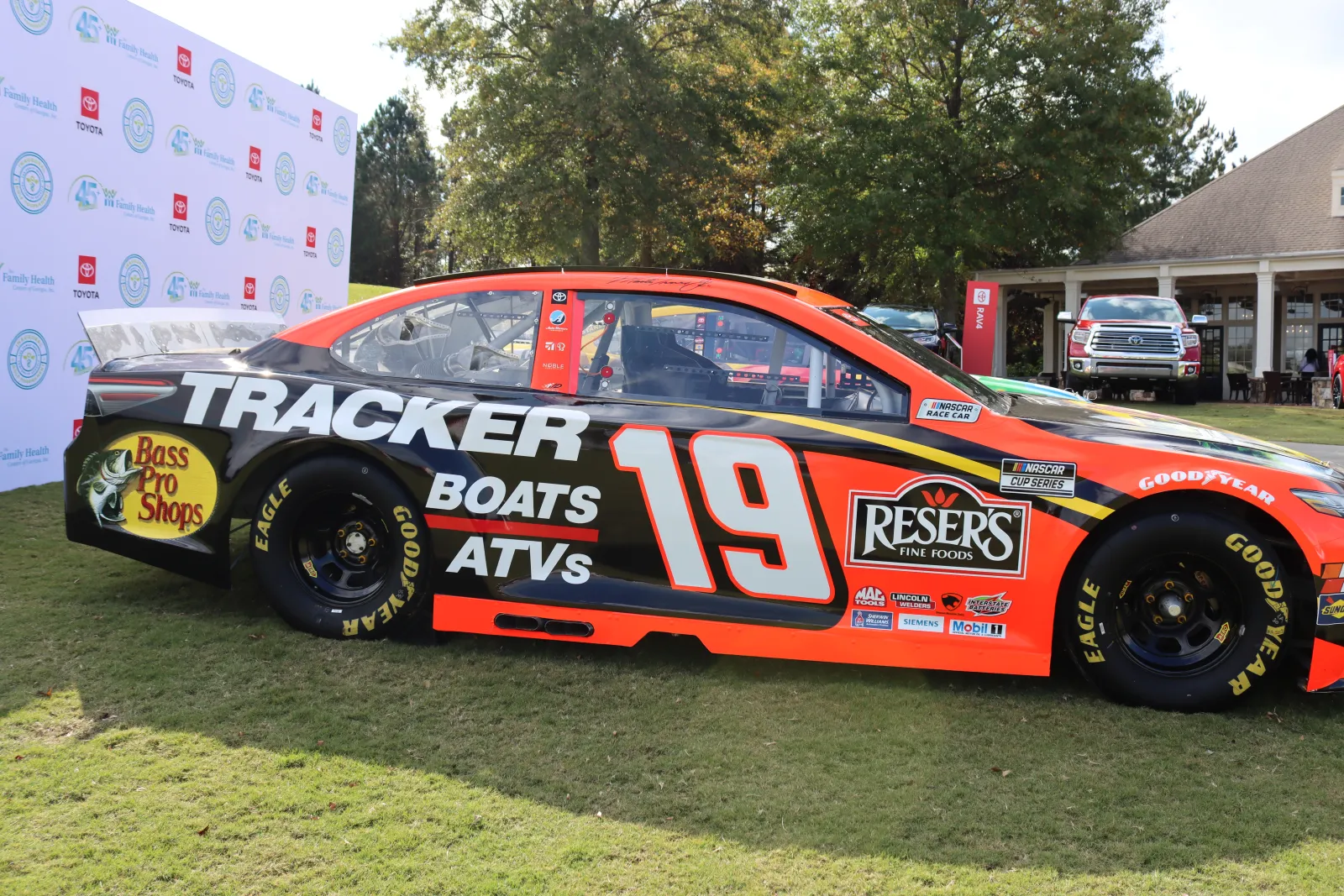 a race car parked on grass