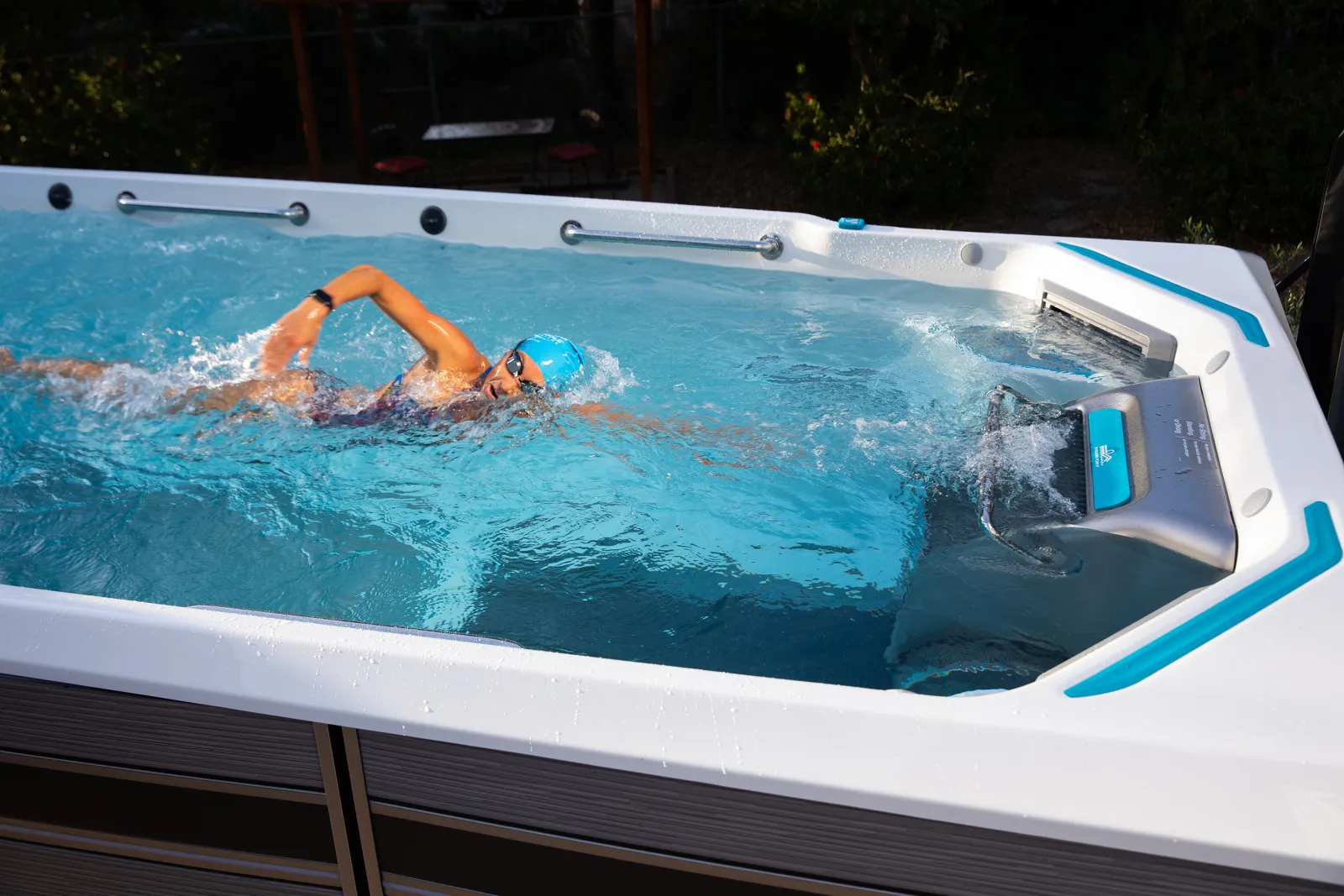 Person swimming in a swim spa.