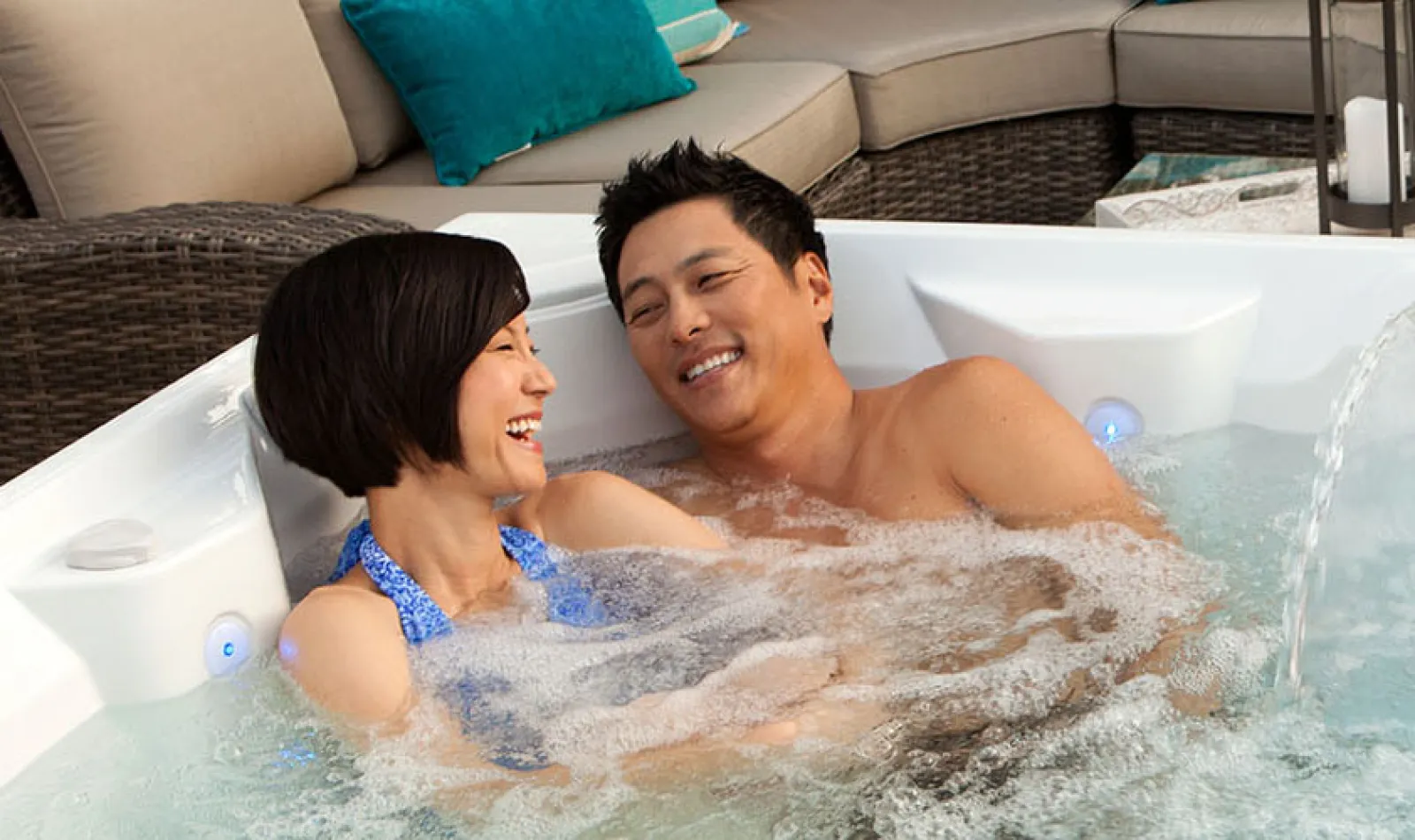 a man and a woman in a hot tub