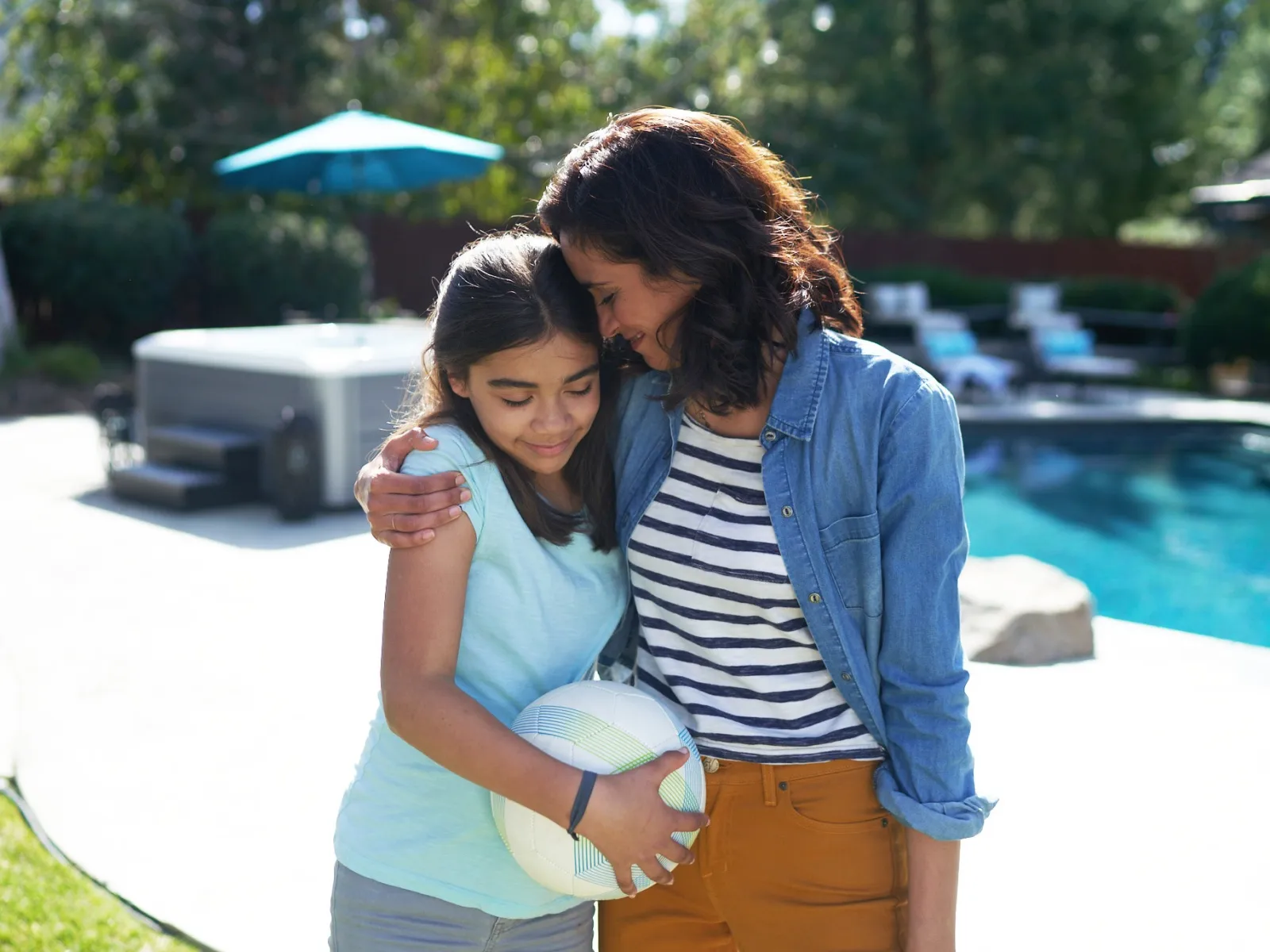 a person and a girl hugging