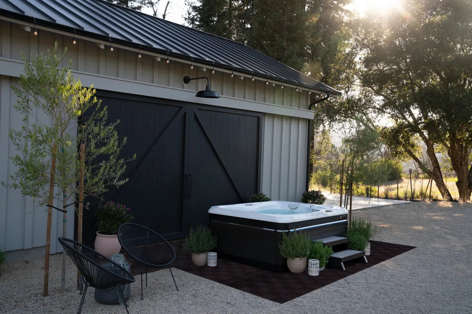 a backyard with a pool and chairs