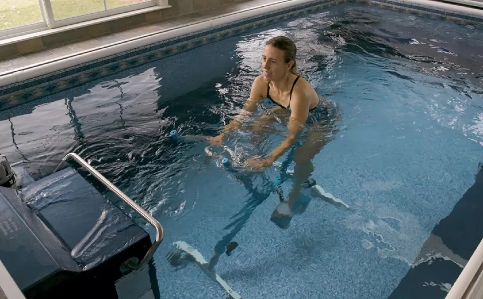 a person in a pool on a bike