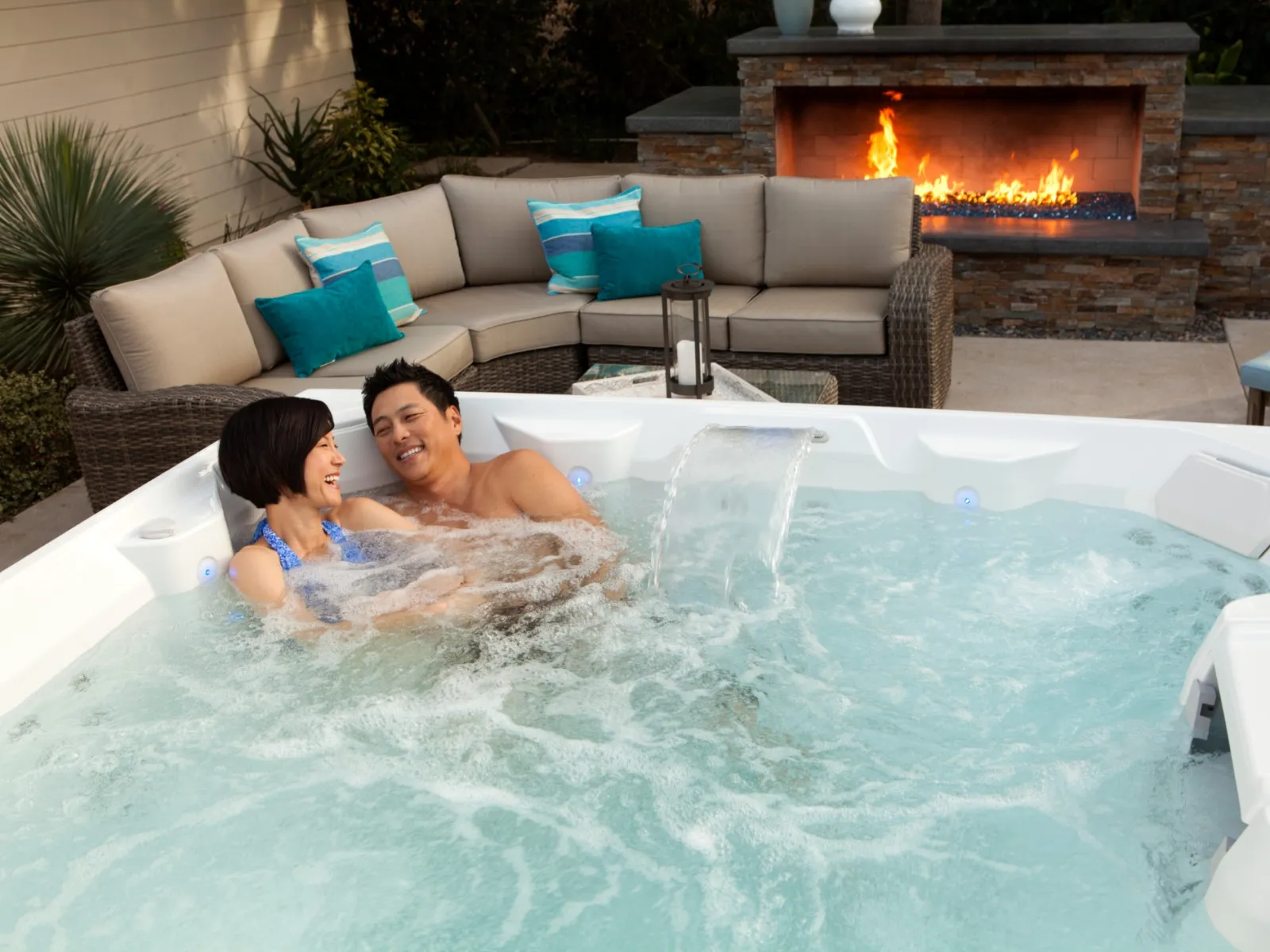 a woman and man in a hot tub