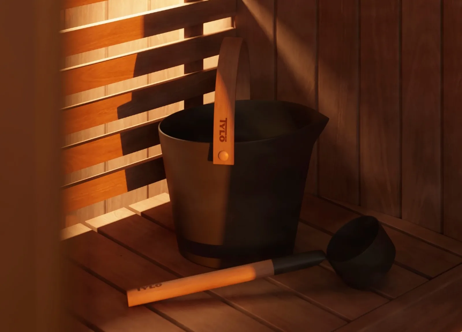 a black bucket with a wooden handle