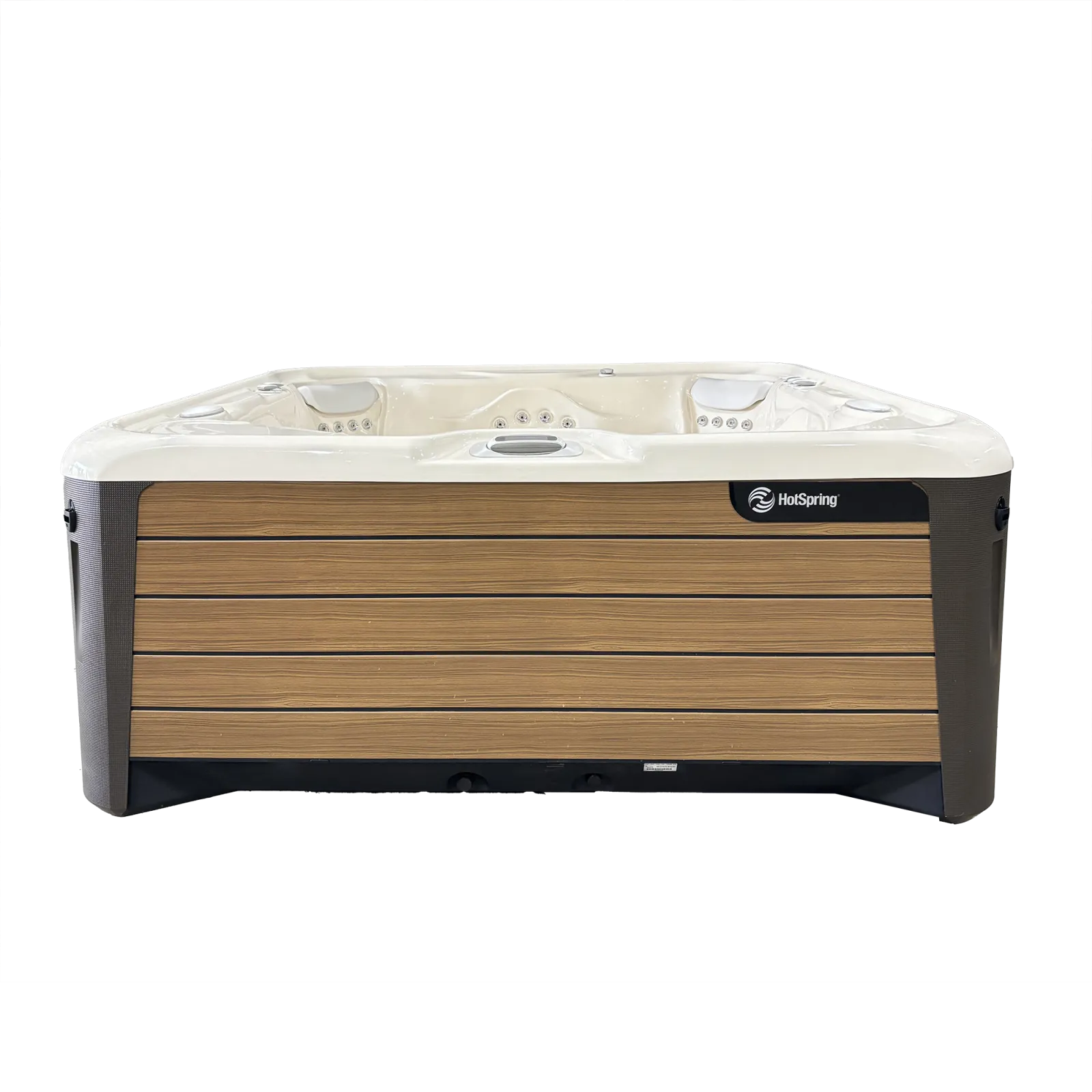 Modern HotSpring hot tub with wood panel exterior and cream interior seating and jets