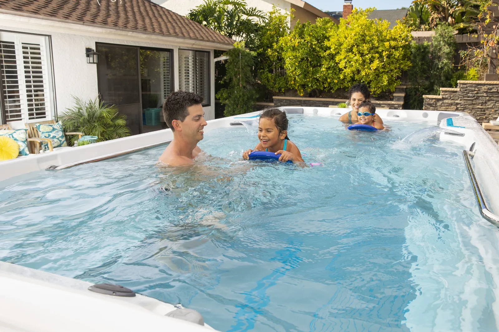 Man teaching his daughter to swim.