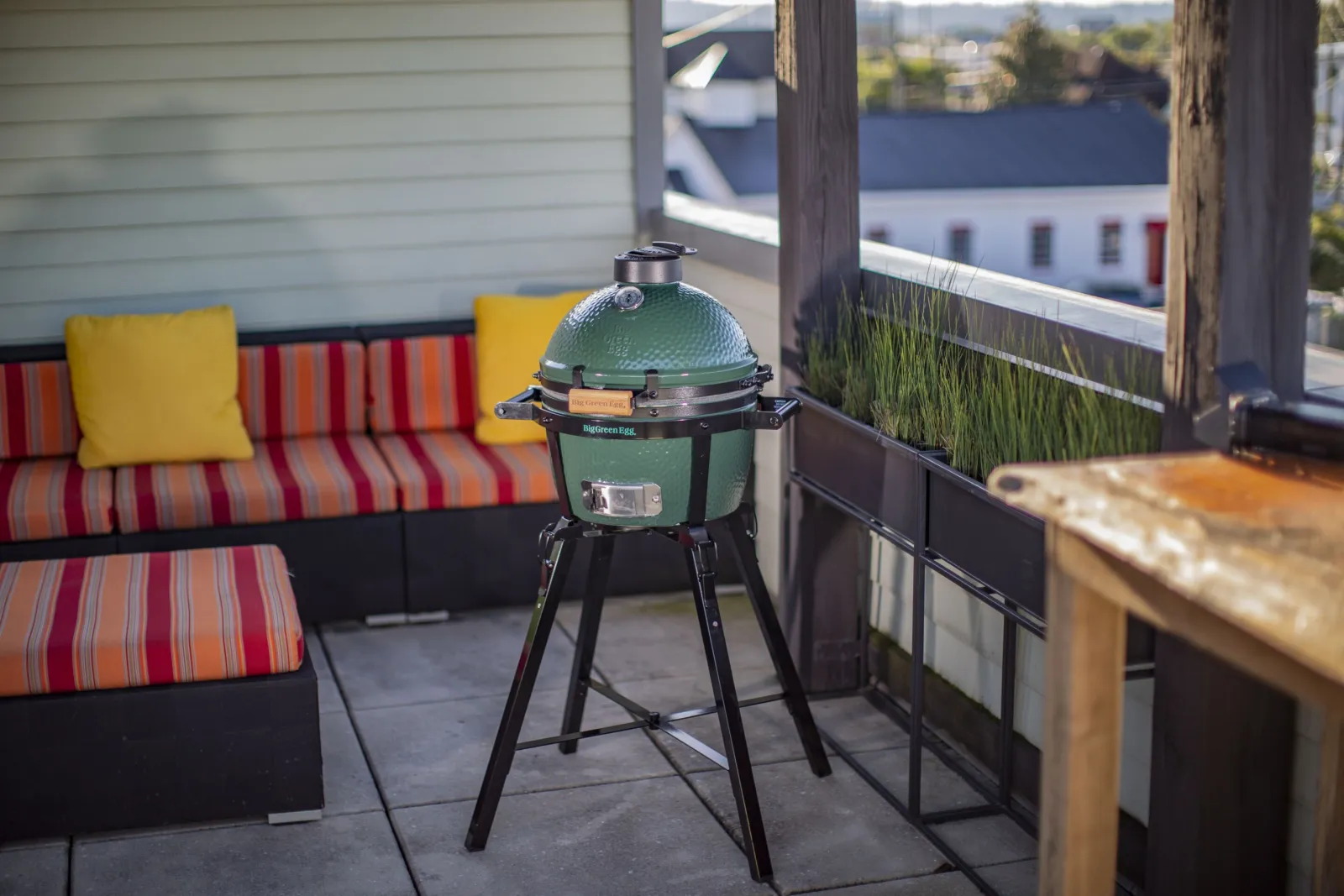 a Big Green Egg on a patio