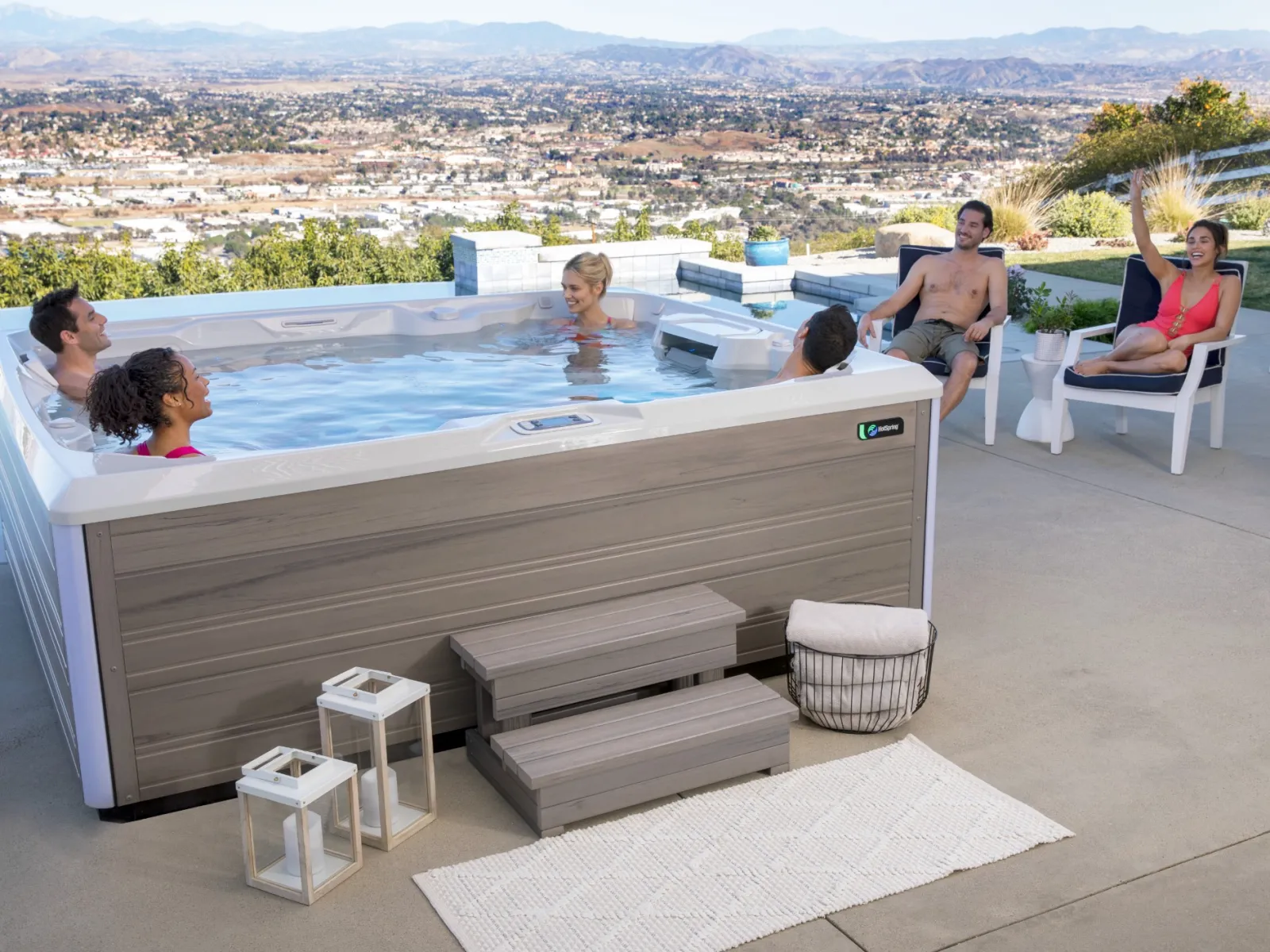 a group of people sitting around a hot tub
