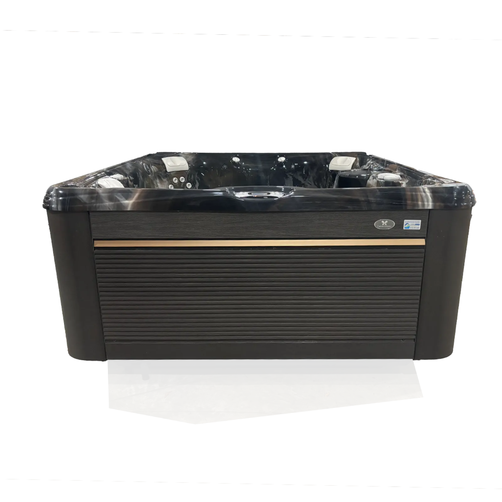 Modern black and gray outdoor hot tub with multiple jets and cushioned headrests on concrete floor.