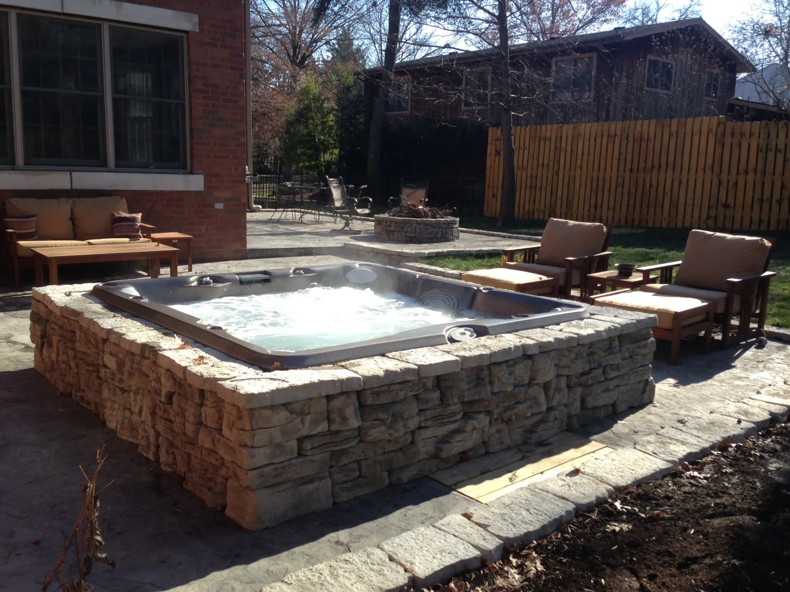 a small hot tub in a backyard