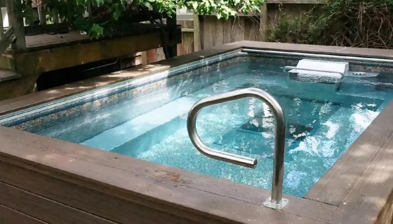 a pool with a hand rail