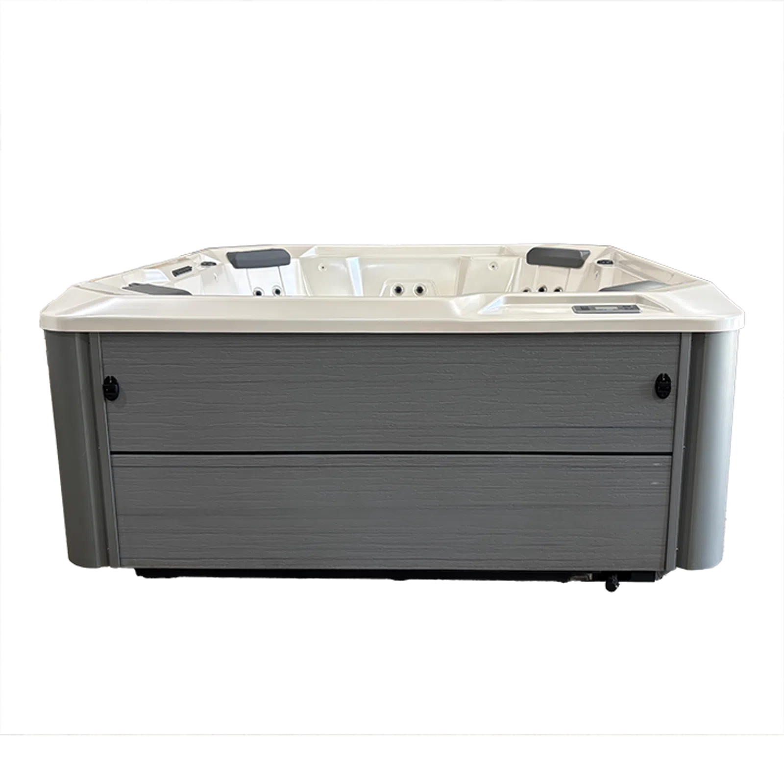 Modern rectangular hot tub with gray exterior panels and white interior seating with jets