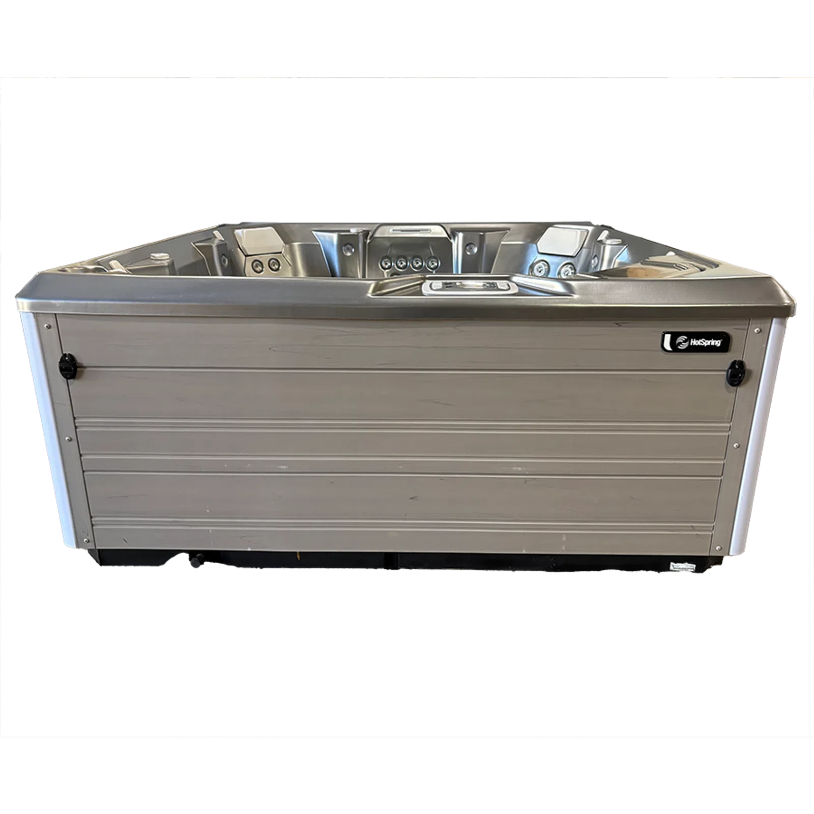 Modern rectangular hot tub with gray wooden panel exterior and white interior featuring jets and headrests.