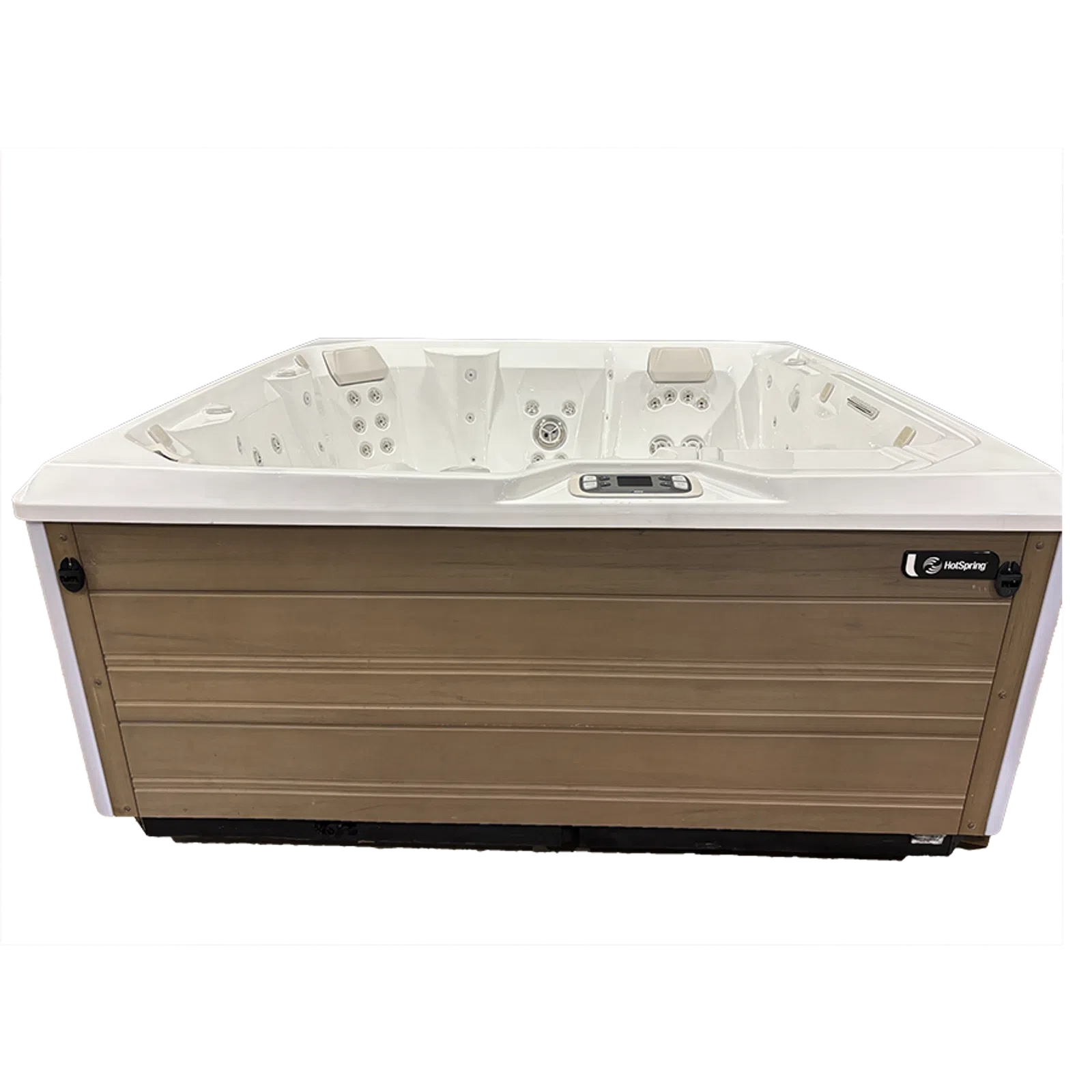 White and wood-paneled HotSpring brand outdoor hot tub with multiple jets and digital control panel on transparent background