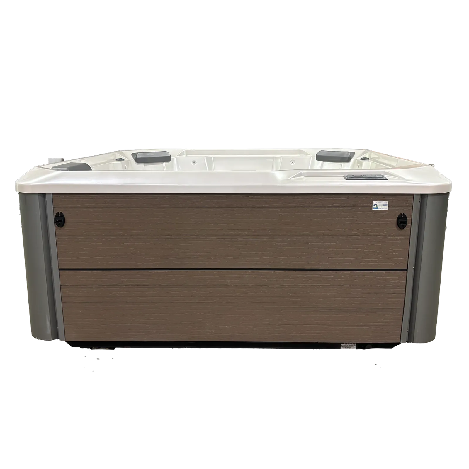 Modern rectangular hot tub with wood panel exterior and white interior with headrests and jets