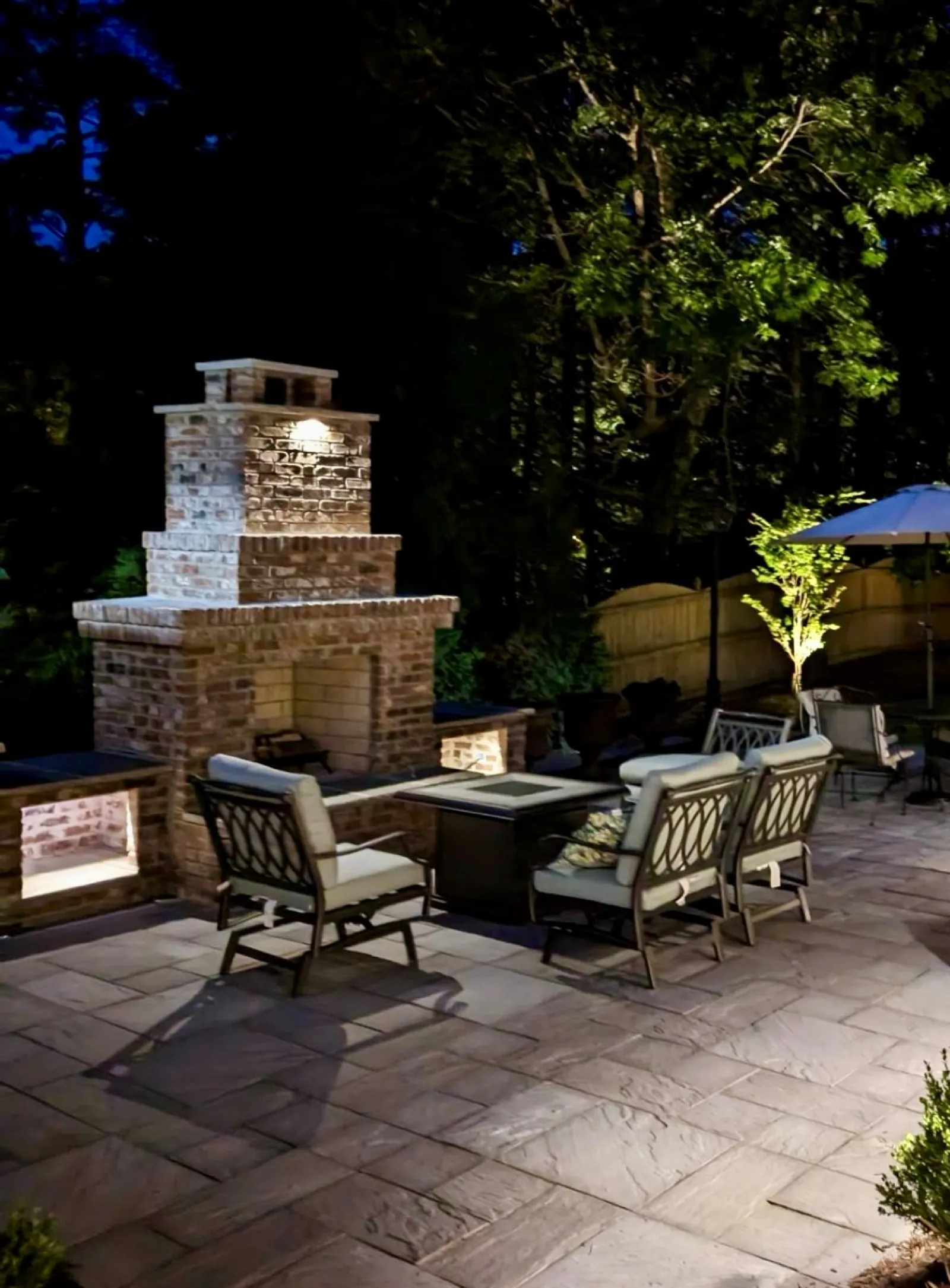 a patio with chairs and tables