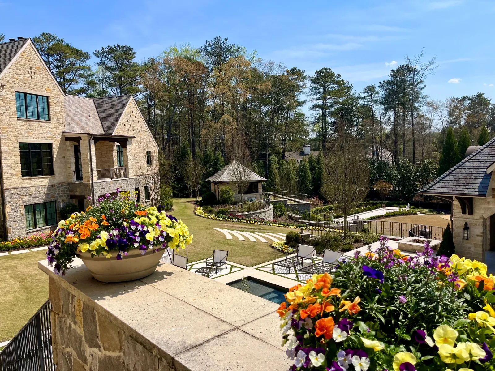 a garden with flowers and a house