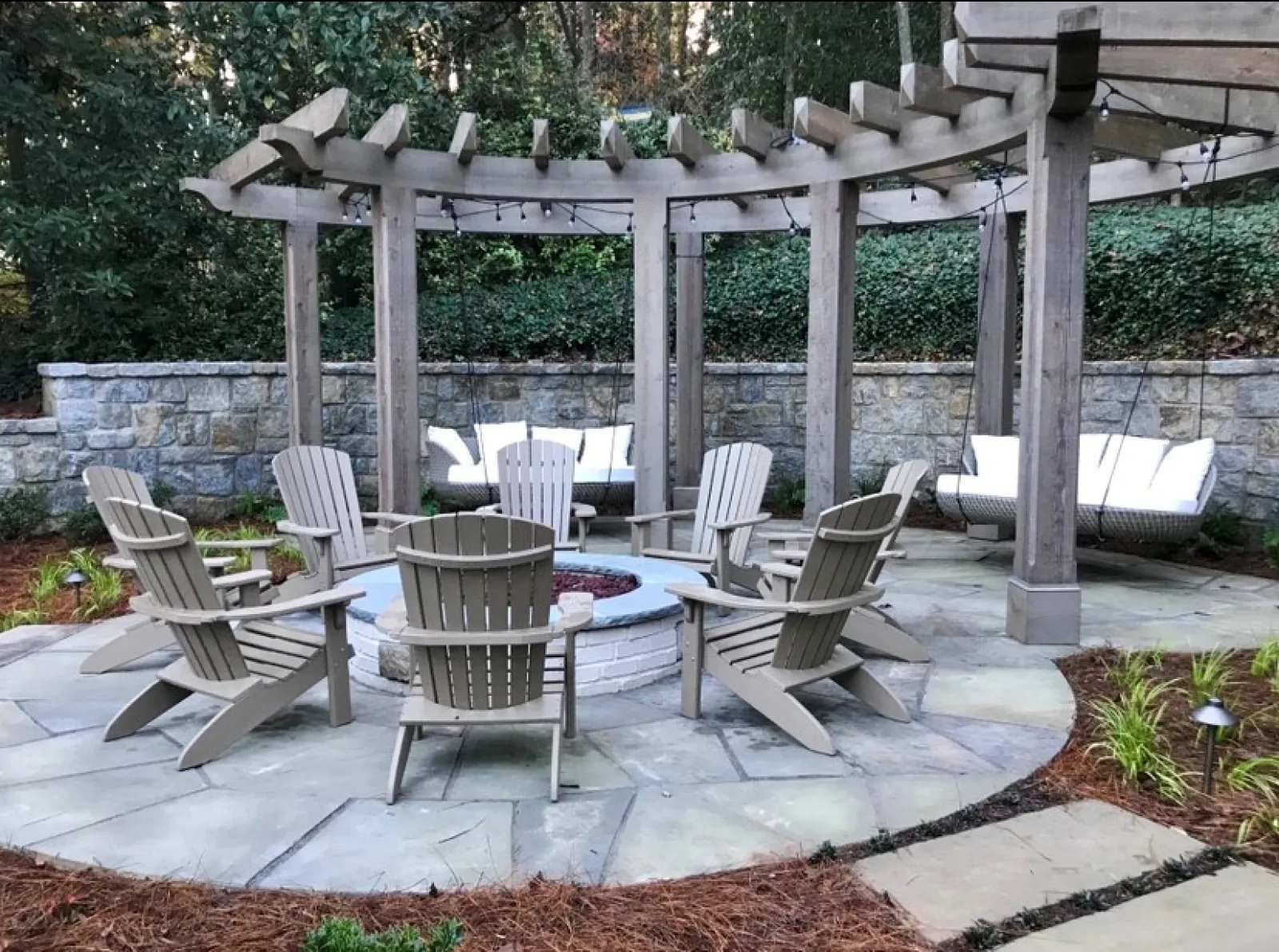 a patio with chairs and tables