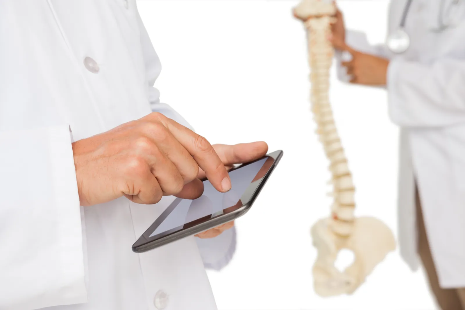 a doctor pointing at a tablet