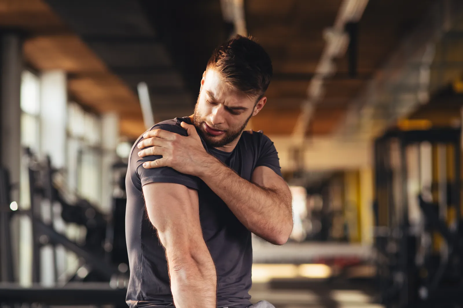 a person holding his shoulder