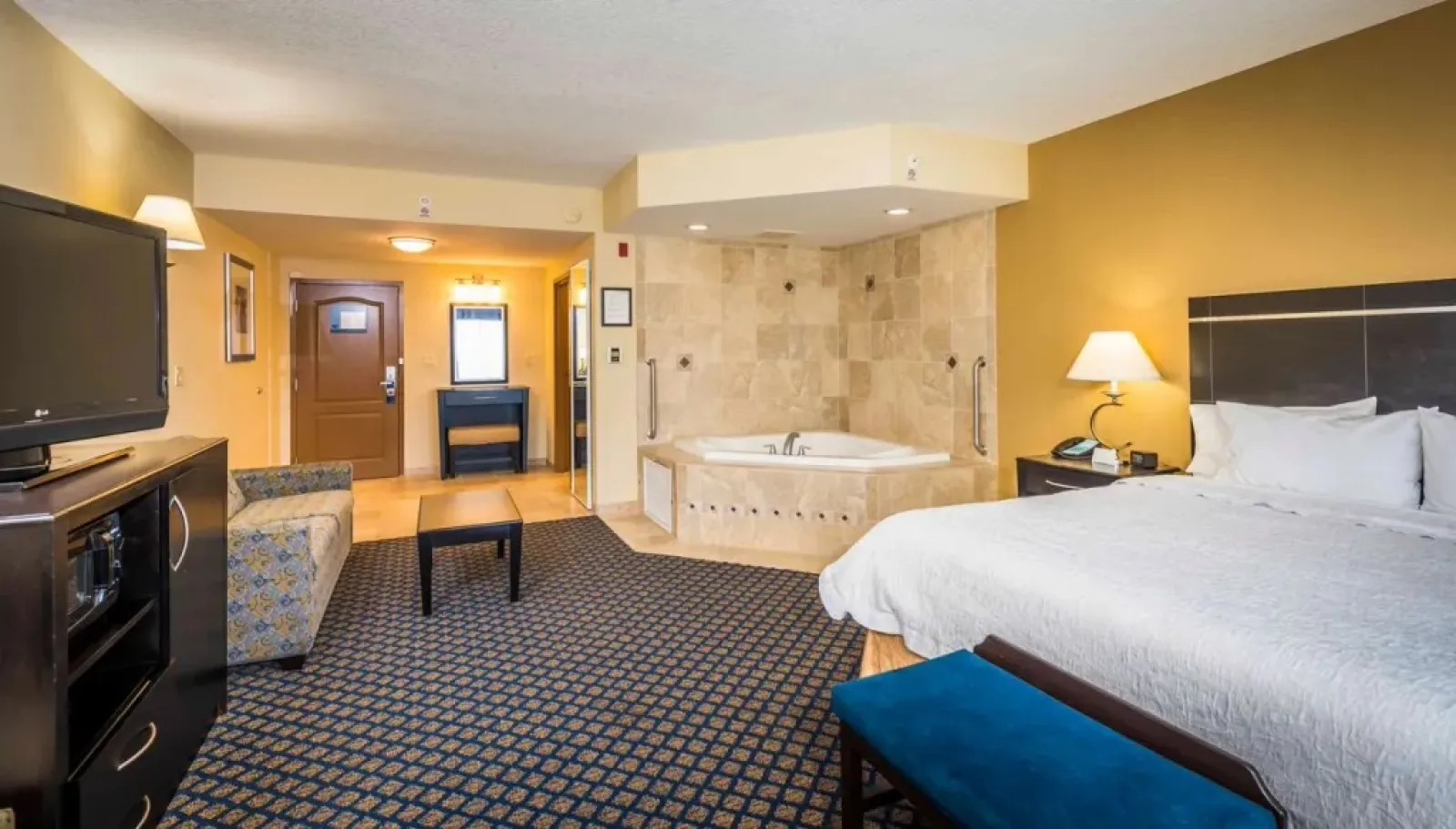 a large bathroom with a large bed