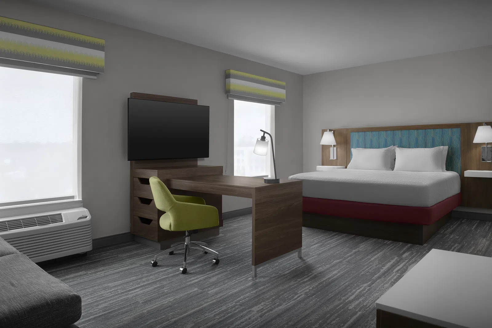 Modern hotel room with king bed, wooden desk, green swivel chair, TV, and natural light from two windows.