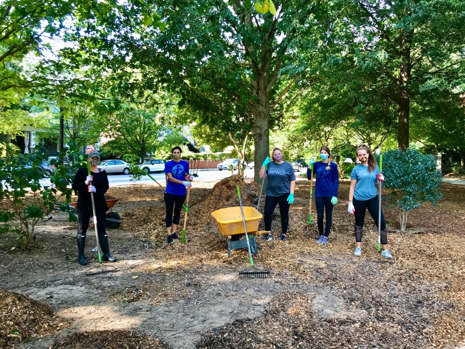 a group of people shoveling dirt
