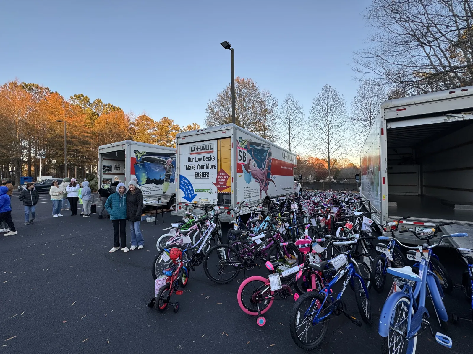 a group of bicycles parked in a parking lot