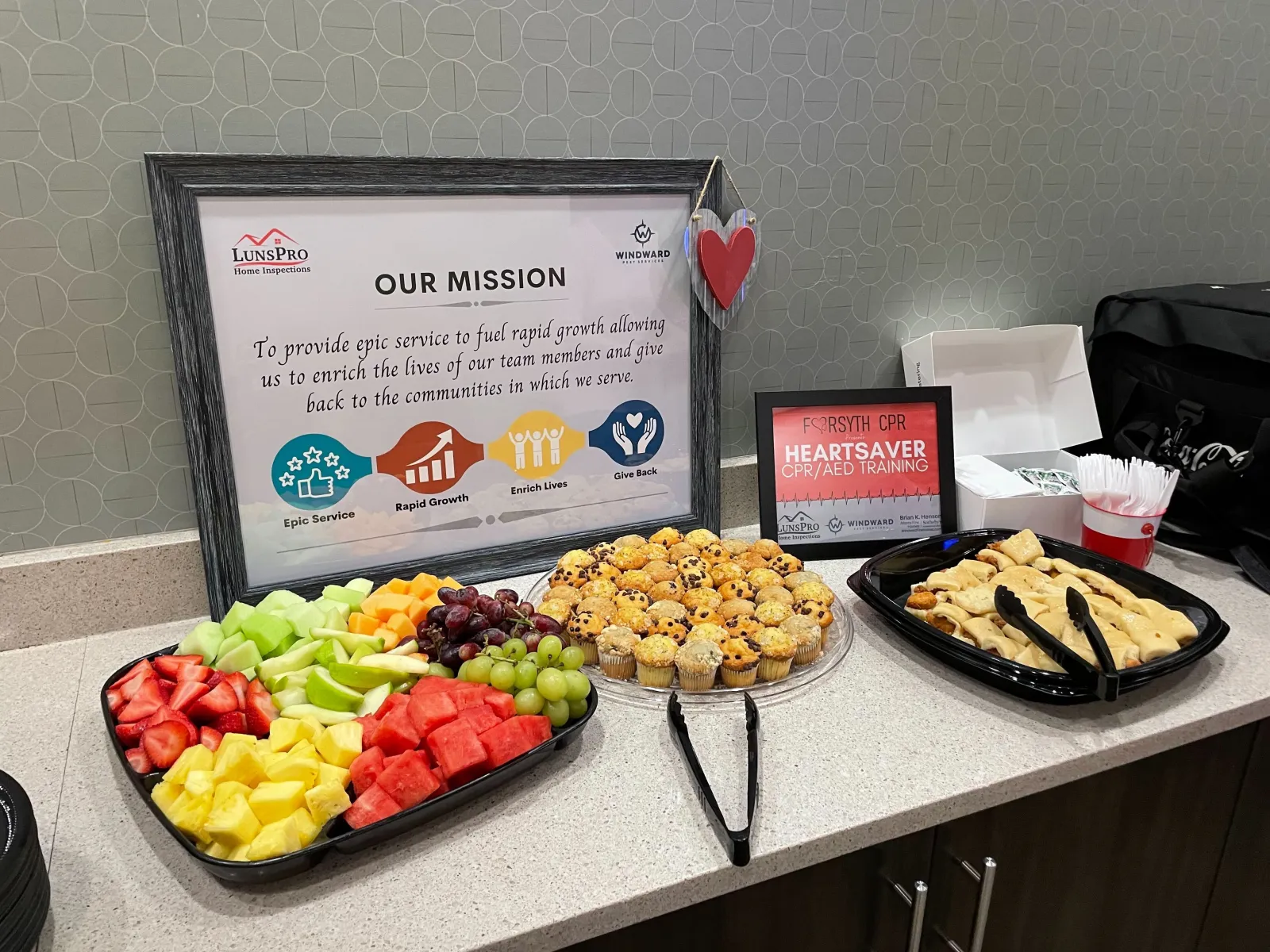 a table with food and a sign