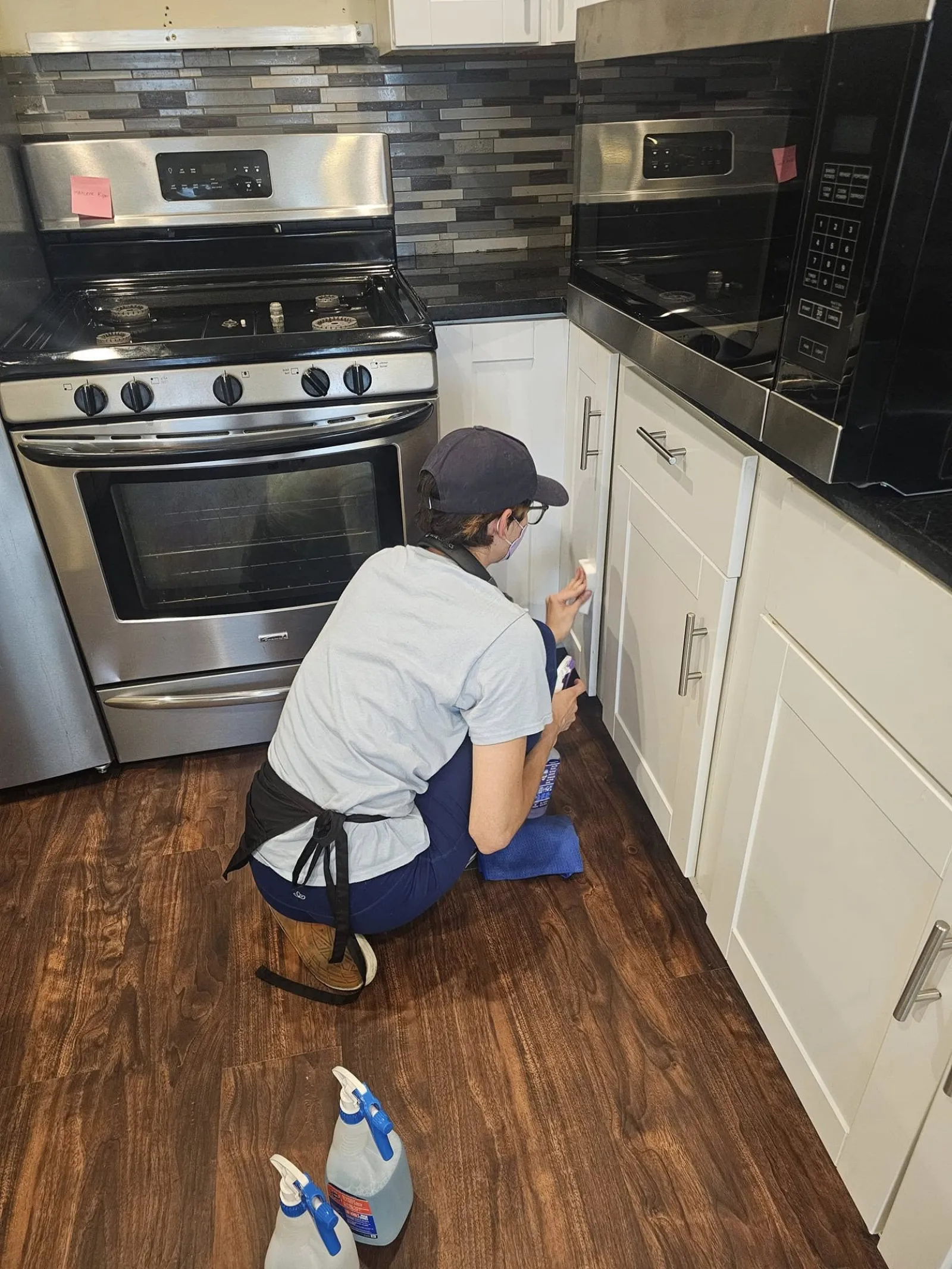 MaidPro Chicago Downtown, West and South cleaning professional scrubbing kitchen cabinets