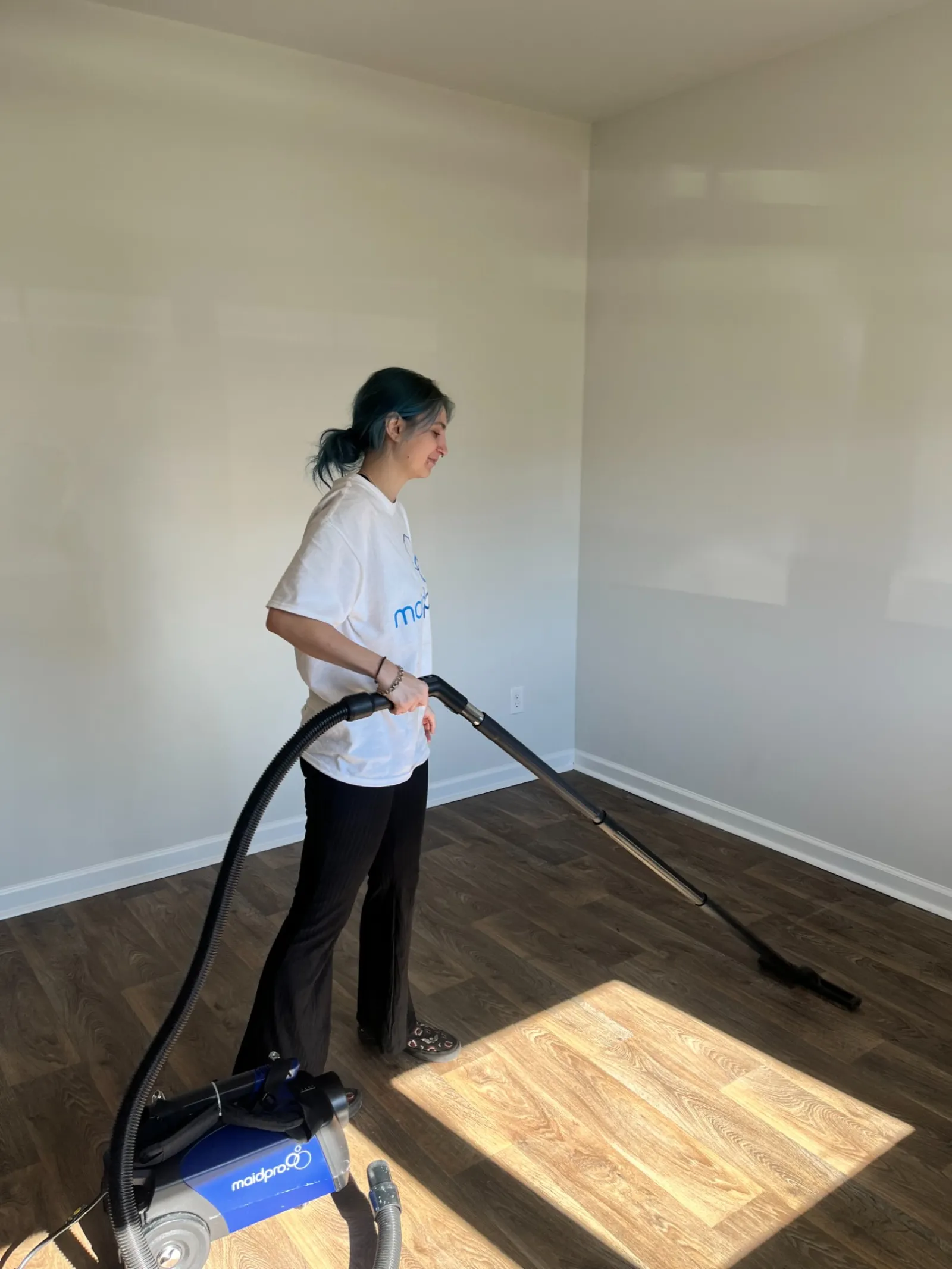MaidPro Summerville house cleaning PRO vaccuming a floor