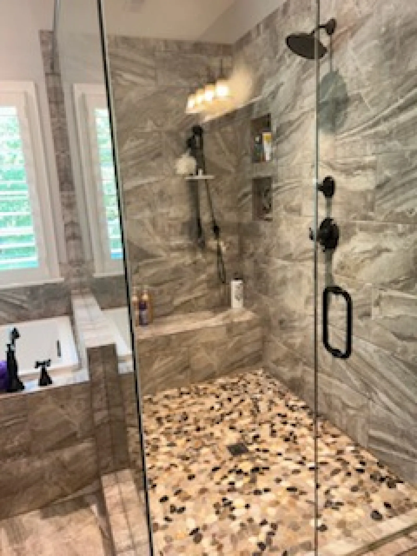 a shower with a glass door cleaned by the experts, MaidPro 
