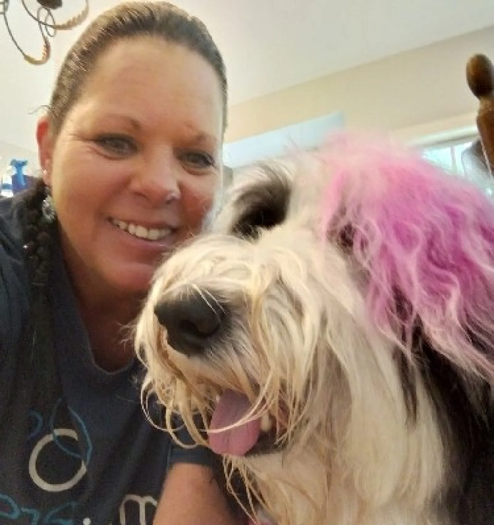 MaidPro Salisbury taking a photo with a customer's dog