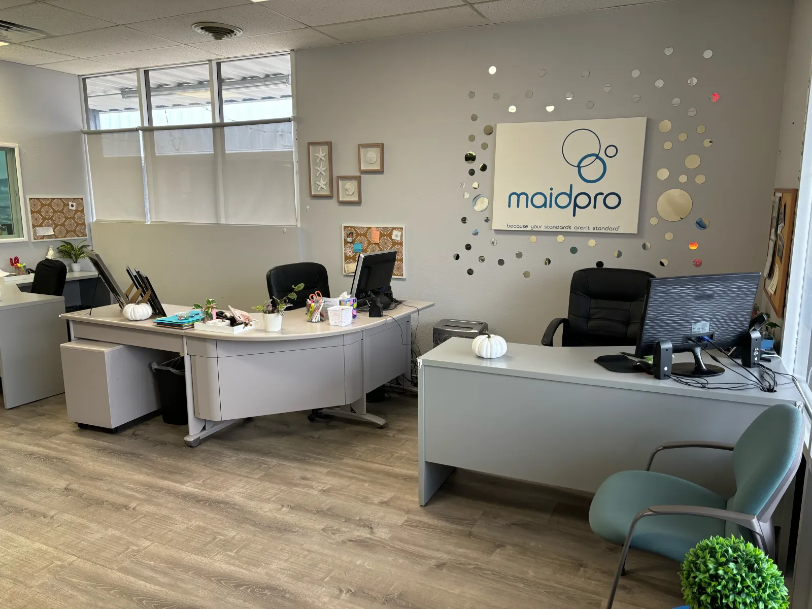 an office with a desk and chairs