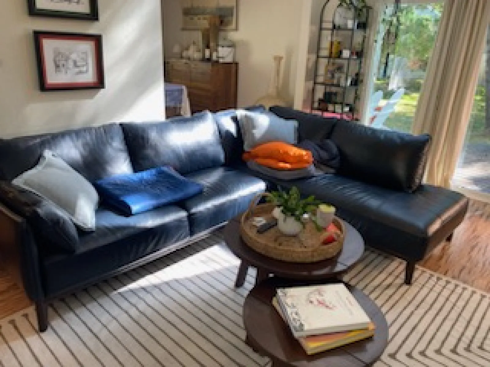 a living room with a black couch