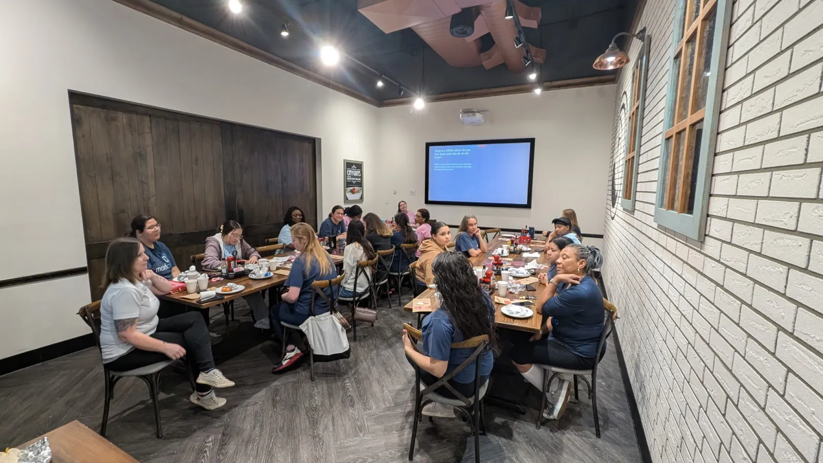a group of people sitting around a table