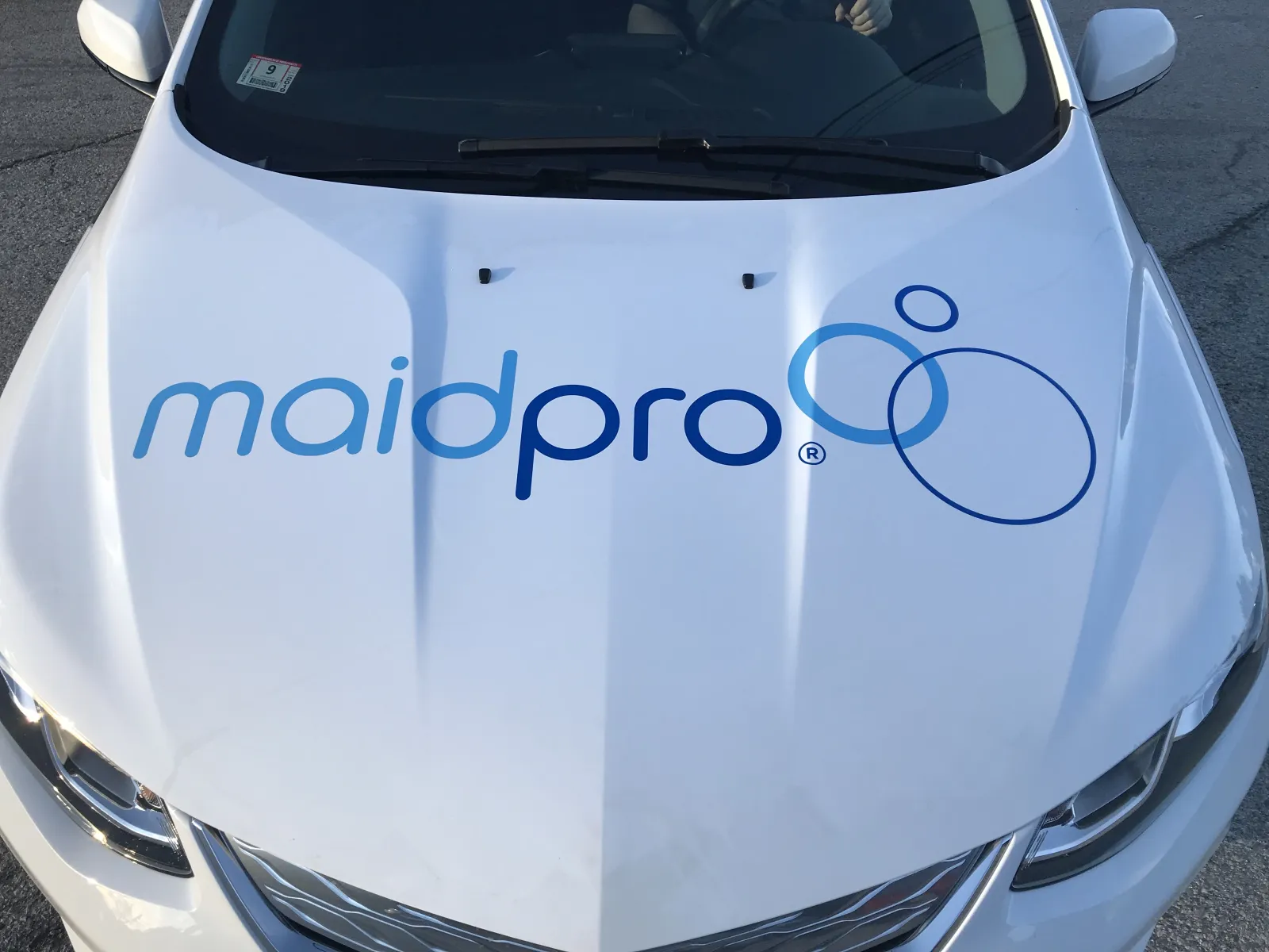 hood of a MaidPro Tyngsborough wrapped company car