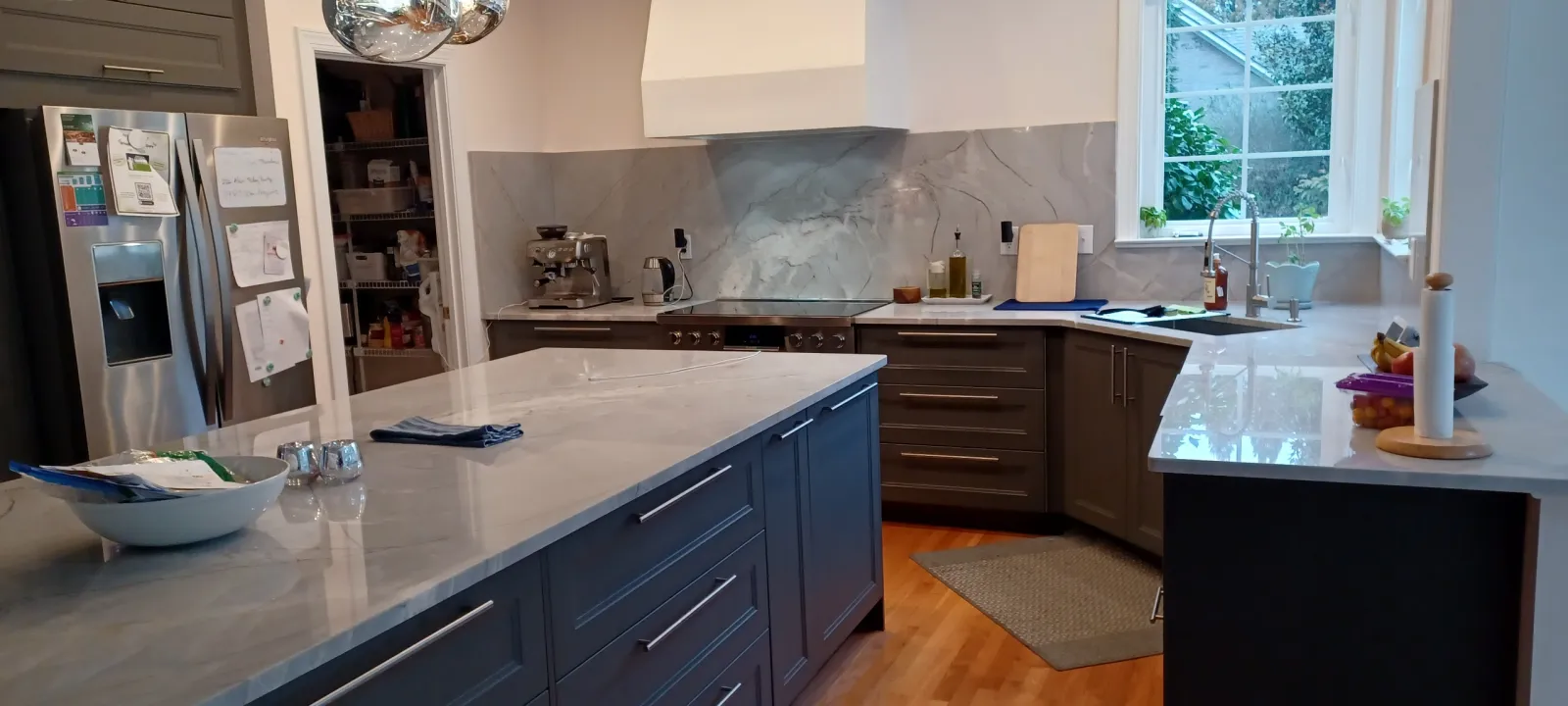 a kitchen with a marble counter top cleaned by cleaning professionals at MaidPro Salisbury