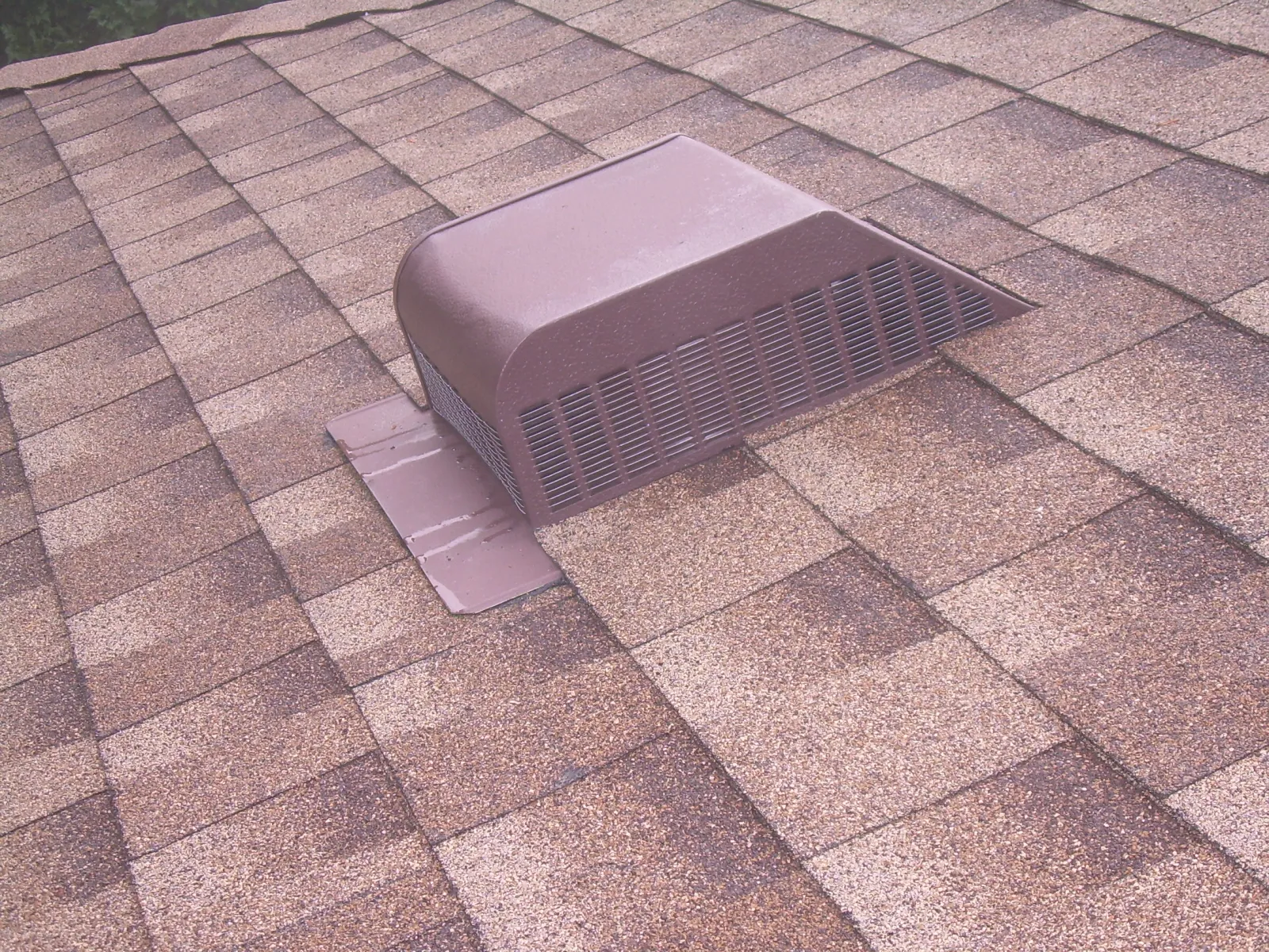 a square object on a brick surface