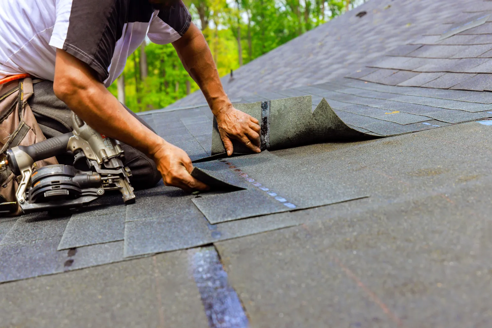 Worker putting shingles