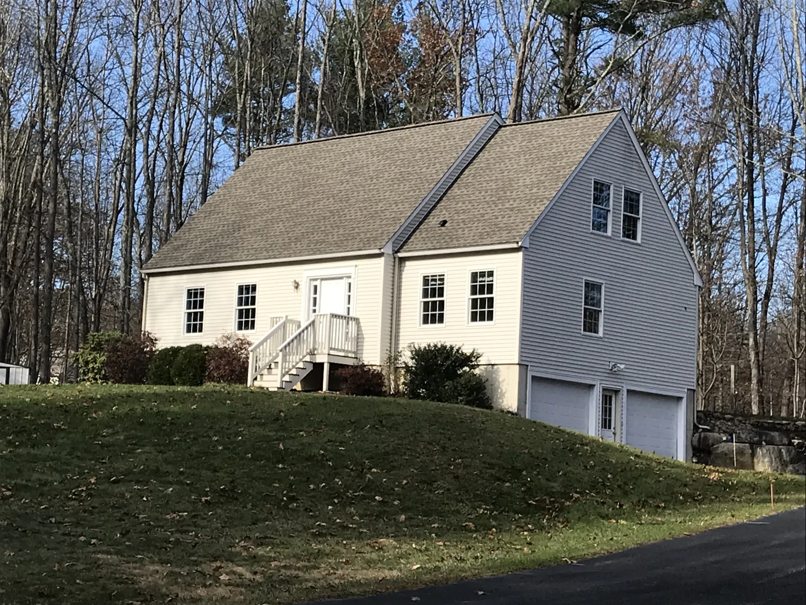 a house with a large yard with Constitution Hall in the background